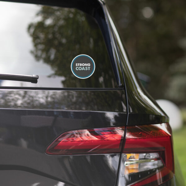 A Strong Coast sticker on a black car